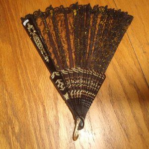 Folding hand fan black lace gold glitter design